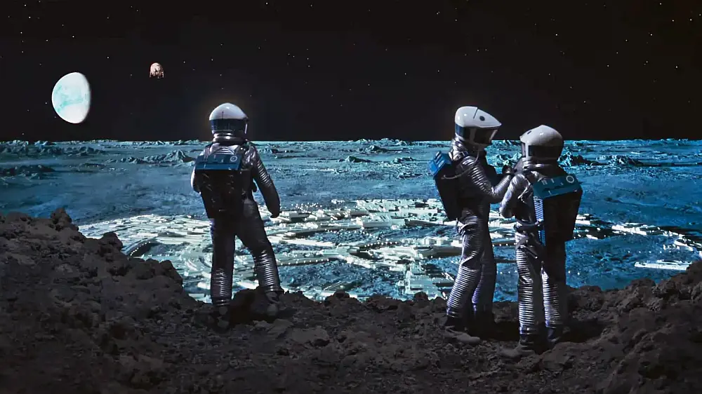 Studios can replicate near enough reality in other formats - including the Moon! Scene from 2001 A Space Odyssey where astronauts can see spacecraft landing and the Earth in the distance.