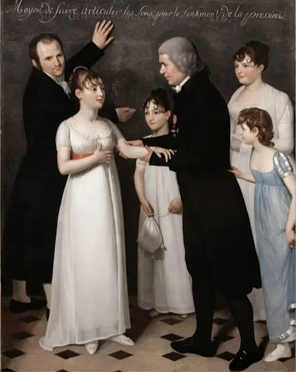 The painting shows the classroom at the Paris school for the Deaf. Jean Massieu, wearing his long coat, and writing on the board in the background whilst the Abbe Sicard holds one of the pupils arms (perhaps to demonstrate sign language). 
