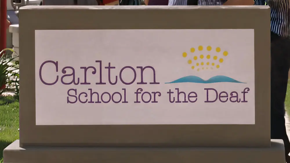 Picture of stone block with the words 'Carlton School for the Deaf.'