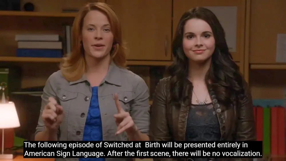 Daphne and Bay inform the viewer about Uprising: 'The following episode of Switched at Birth will be presented entirely in American Sign Language. After the first scene, there will be no vocalisation.'
